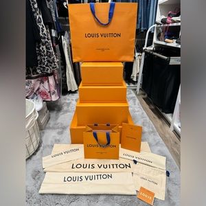 4 Louis Vuttion Boxes, 5 dust bags, 3 shopping bags. Used